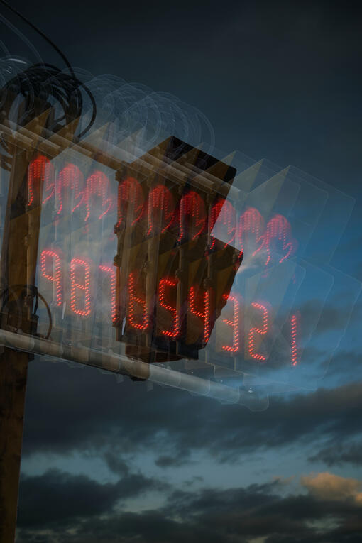 Passage of time depicted through a pedestrian signal light